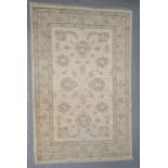 Modern cream ground Eastern-style rug with foliate decoration, 148cm x 93cm