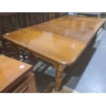 Large mahogany William & Mary-style extending dining table, the rectangular top with rounded