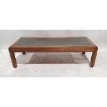 Modern Chinese-style low coffee table of rectangular form, the smoked glazed top enclosing woven