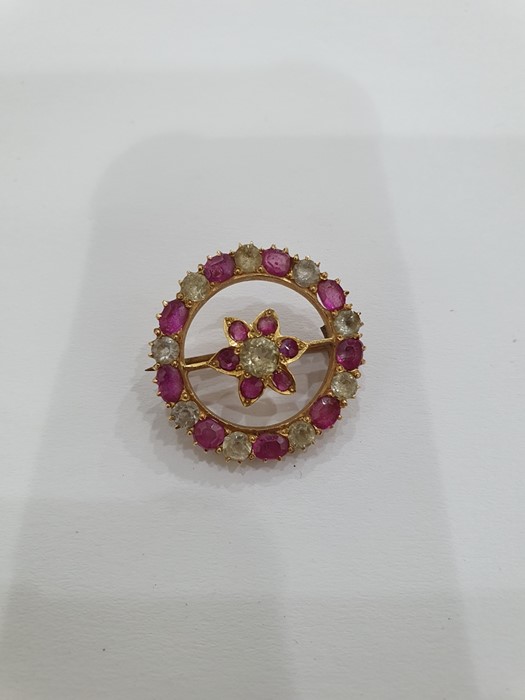 Probably Indian gold-coloured brooch of circular form with a central flower detail, set with - Image 2 of 13