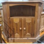 Pine corner low cabinet with open tier above two cupboard doors, on plinth base, 84cm high