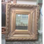 20th century rectangular mirror with bevel edged plate, heavy moulded frame, 52cm x 46cm and another