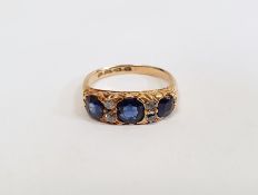 18ct gold, sapphire and diamond ring set three rectangular-cut sapphires alternating with two