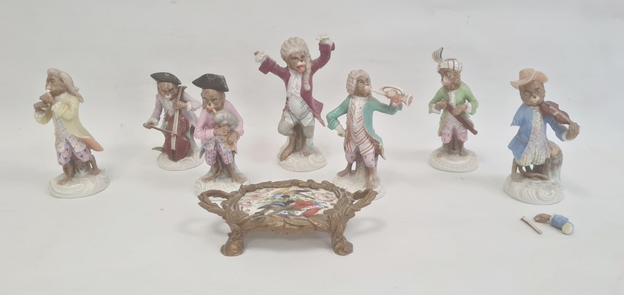Continental porcelain monkey band in the Meissen manner, viz:- seven monkeys, some with damage and