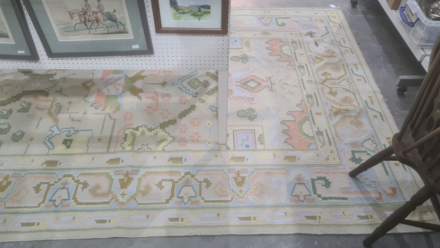 Modern cream ground rug in blues, peaches, yellows, greens and duck egg blue ground border, 280cm