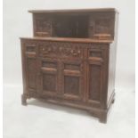 Reproduction oak court cupboard in the Elizabethan taste, with cupboard doors to top above single