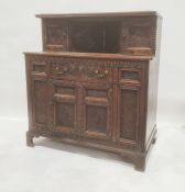 Reproduction oak court cupboard in the Elizabethan taste, with cupboard doors to top above single