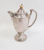 George V silver coffee pot with ivy finial and leaf relief decoration to handle, on circular base,