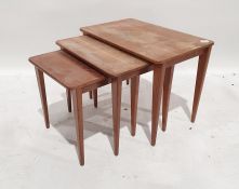 Nest of three mid-century teak Gordon Russell coffee tables on tapering supports