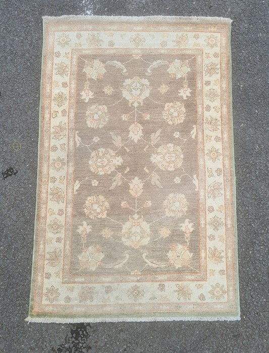 Mushroom ground modern Eastern-style rug with foliate decoration, cream ground border, 154cm x 97cm