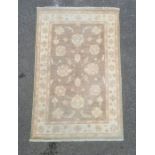 Mushroom ground modern Eastern-style rug with foliate decoration, cream ground border, 154cm x 97cm