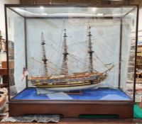 Painted wooden model of The Royal Yacht Caroline 1749, in glazed and stained wood table-top cabinet,