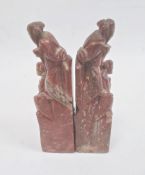 Pair Chinese carved soapstone seals, each surmounted by two male figures, 12cm high