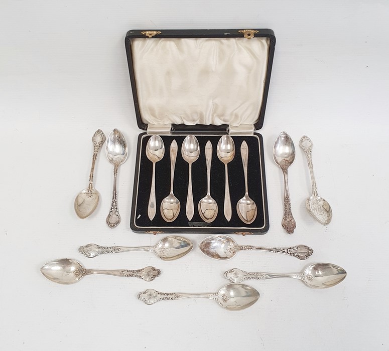 Nine various sterling silver teaspoons with floral decorated handles and a set of six silver