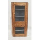 Early 20th century oak corner food cupboard, the grilled door above single drawer and grilled door