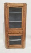 Early 20th century oak corner food cupboard, the grilled door above single drawer and grilled door