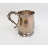 Silver mug by Wakely & Wheeler, London 1936 of plain baluster form, on circular foot with scroll