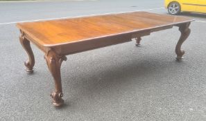 Late Victorian mahogany extending dining table, the rectangular top with rounded corners, moulded