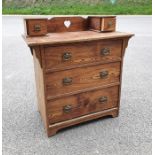 20th century chest of drawers with two drawers to the superstructure, with pierced heart to the