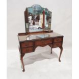 20th century dressing table with three-part mirror above the five assorted drawers, on cabriole legs