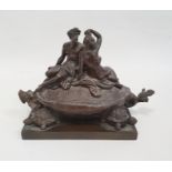 A 19th century bronze inkwell in the form of two nude classical figures seated atop Bixi, a dragon
