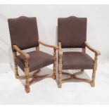 Pair of modern oak-framed armchair with brown upholstered seats and backs, wavy X-shaped stretchered