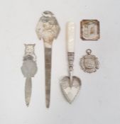 A silver coloured metal letter opener, bird engraved, a silver cat bookmark, marked London,