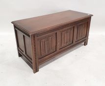 20th century coffer, the rectangular top with moulded edge above three linenfold decorated