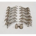 A quantity of silver coloured metal horse knife rests (1 box)