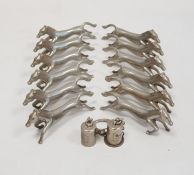 A quantity of silver coloured metal horse knife rests (1 box)