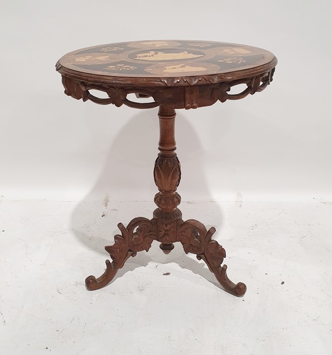 African-style walnut and marquetry inlaid centre table, the top inset with various African and other