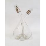 Late Edwardian silver-mounted glass double oil and vinegar decanter with clear glass stoppers,