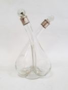 Late Edwardian silver-mounted glass double oil and vinegar decanter with clear glass stoppers,