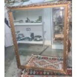 Modern rectangular bevel edged mirror in moulded gold-coloured frame, 112cm x 86cm