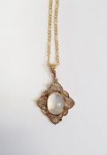 Gold-coloured metal and moonstone oval pendant set single stone in openwork filigree mount and the