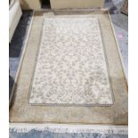 Modern cream ground rug with leaf decoration, gold borders, 280cm x 202cm Condition ReportPicture of