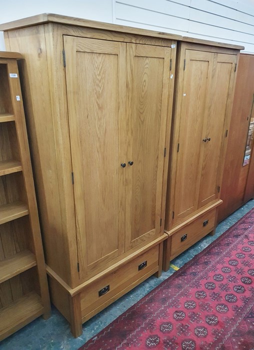 Pair of modern oak two-door wardrobes with single drawer under, 90cm x 182.5cm (2)