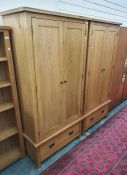 Pair of modern oak two-door wardrobes with single drawer under, 90cm x 182.5cm (2)