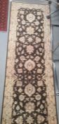 Modern Eastern-style brown ground rug with cream foliate decoration, 306cm x 84cm