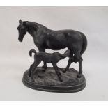 Black painted cast metal group of a mare and foal on oval plinth base, 23cm high