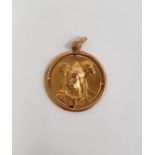 Gold-coloured pendant of circular form depicting a warrior, marks rubbed, approx 1.9g