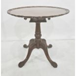 Mahogany snap-top table in the Georgian taste, the applied moulded edge above birdcage, turned and