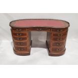 Early 20th century French-style ormolu-mounted rosewood kidney-shaped writing desk having brass