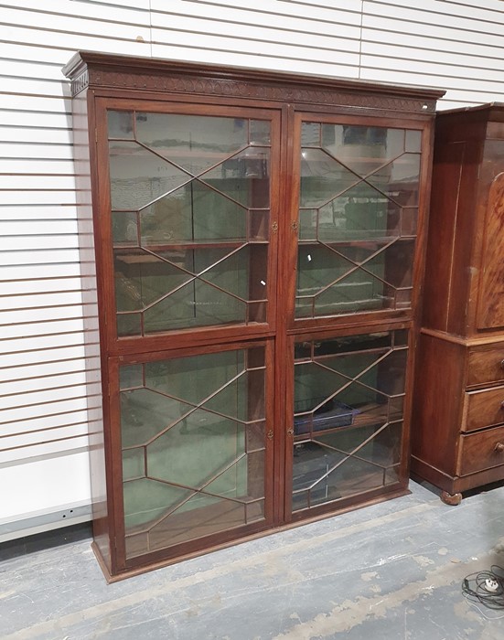 19th century mahogany tall bookcase, the moulded cornice above four astragal glazed doors arranged