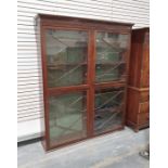 19th century mahogany tall bookcase, the moulded cornice above four astragal glazed doors arranged