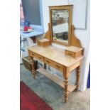 Early 20th century pine dressing table with rectangular mirror above two short drawers, the base