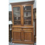 Late 19th/early 20th century bookcase cupboard with ogee moulded corners above two glazed doors