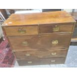 Probably late Victorian mahogany campaign chest, the rectangular top with brass bindings, two