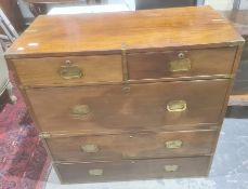 Probably late Victorian mahogany campaign chest, the rectangular top with brass bindings, two