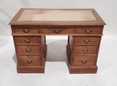 20th century oak pedestal desk with nine assorted drawers, on plinth base (Made mid 20th century